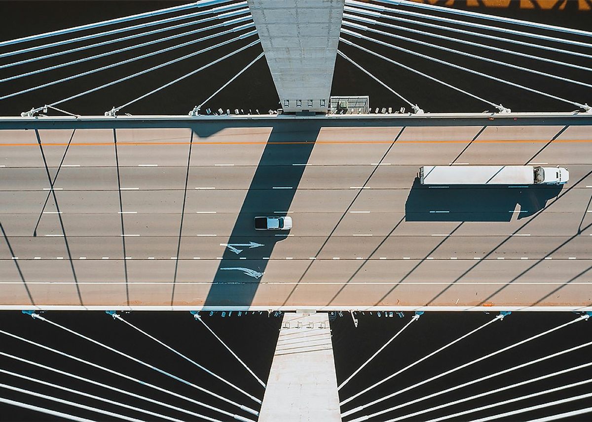 Truck driving on bridge